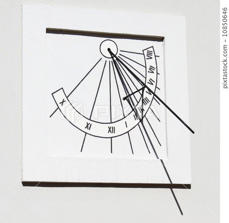 Ancient solar clock is located on the wall 10850646