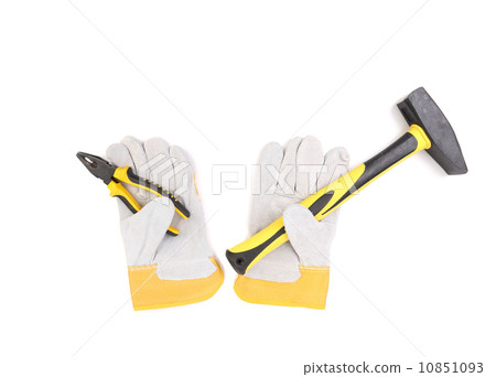 Gloves holding hammer and pliers. Gloves holding hammer and pliers. 10851093