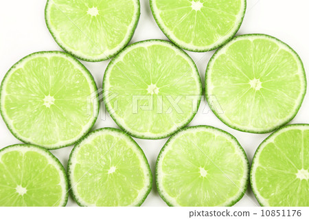 lime slices neatly arranged on a white background 10851176