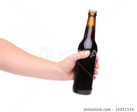 Beer bottle in the hand isolated on white Beer bottle in the hand isolated on white 10851534