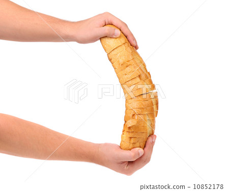 Hands holds sliced long loaf. 10852178