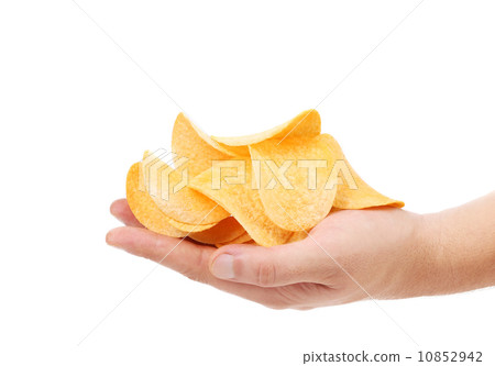 Hand holds chips. Hand holds chips. 10852942
