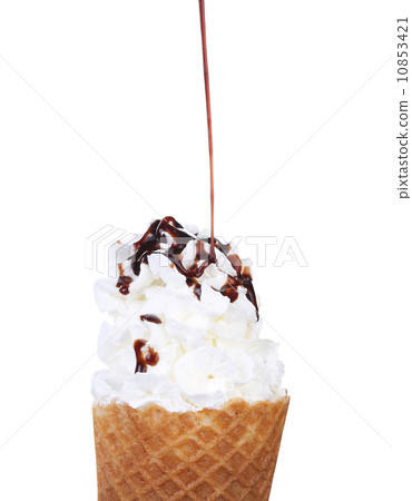 Soft serve ice cream. Topping chocolate. 10853421