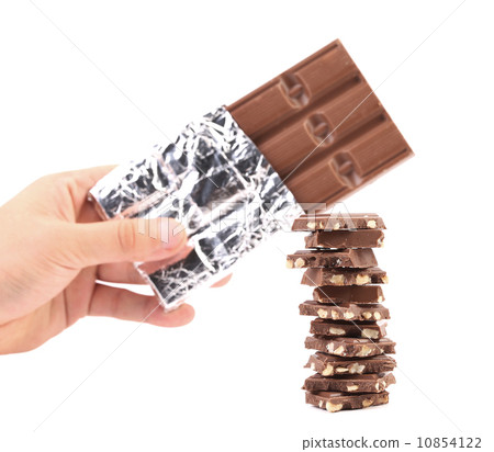 Bar of chocolate in foil and tasty morsel. Bar of chocolate in foil and tasty morsel. 10854122