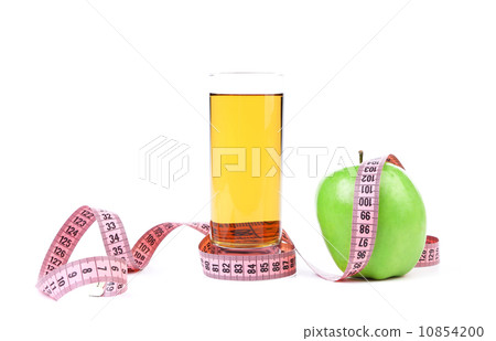 Green apple and juice with measuring tape 10854200