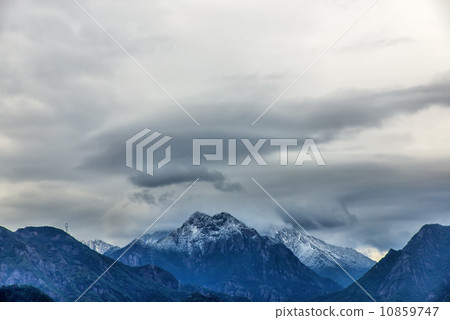 Snow covered mountains 10859747
