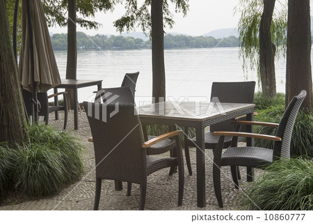 Tables and chairs at the lake Tables and chairs at the lake 10860777