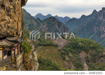 Chinese temple in the cliff and mountain scenery (Wenzhou yandang mountain in China.) Chinese temple in the cliff and mountain scenery (Wenzhou yandang mountain in China.) 10861691