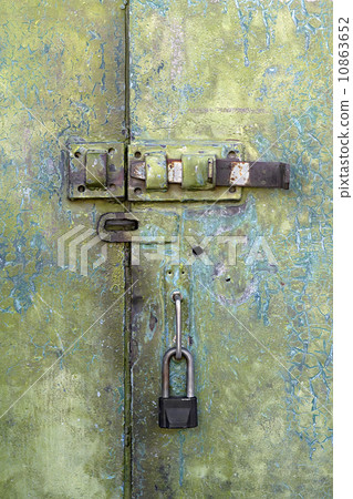 old iron door with a lock and hasp 10863652