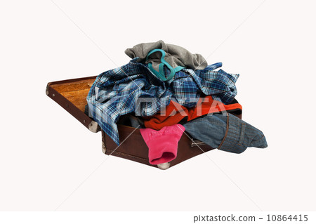 stack of clothes in opened suitcase isolated on white background 10864415