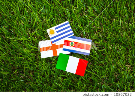 Paper cut of flags on grass for Soccer championship 2014 , group Paper cut of flags on grass for Soccer championship 2014 , group 10867022