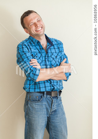 Young laughing Caucasian man in casual shirt, studio portrait Young laughing Caucasian man in casual shirt, studio portrait 10868956