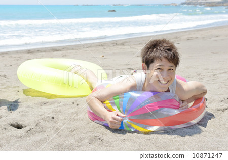 A young man playing on the beach 10871247