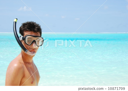 Young man ready to go snorkeling (blue ocean background) 10871709