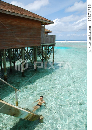 Young man relaxing in Maldives 10871716