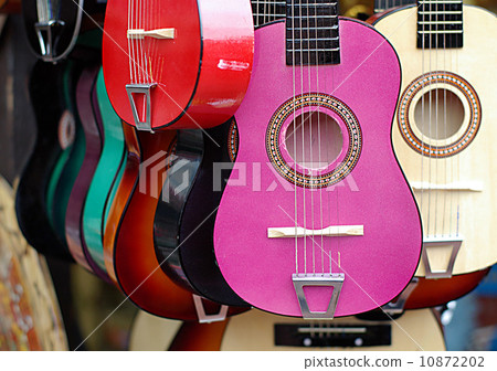 Mexican guitars in the musical instruments shop 10872202