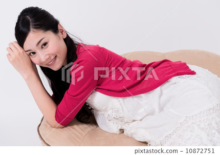 Woman relaxing in the living room Woman relaxing in the living room 10872751
