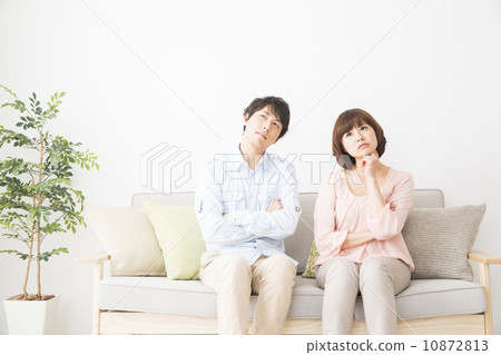 A couple sitting on the sofa A couple sitting on the sofa 10872813