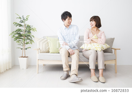 A couple sitting on the sofa 10872833