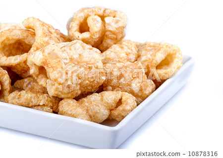 Pork rinds on white dish Pork rinds on white dish 10878316