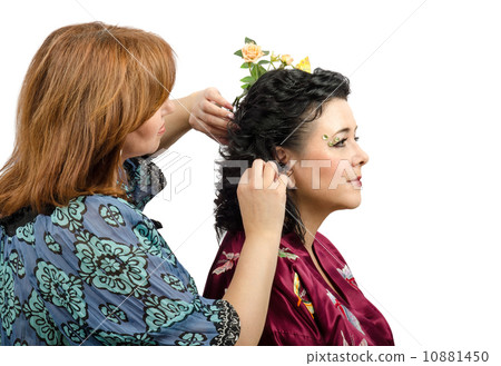 Red-haired hairdresser giving a new hairstyle to mature woman Red-haired hairdresser giving a new hairstyle to mature woman 10881450