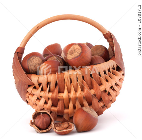 Hazelnuts in wicker basket 10881712