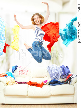 Funny girl with flying clothes jumping at home Funny girl with flying clothes jumping at home 10885071