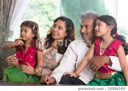 Indian family looking to side 10886169