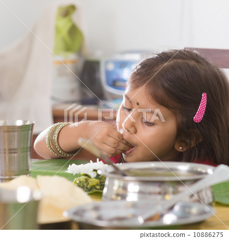 Indian girl eating rice 10886275