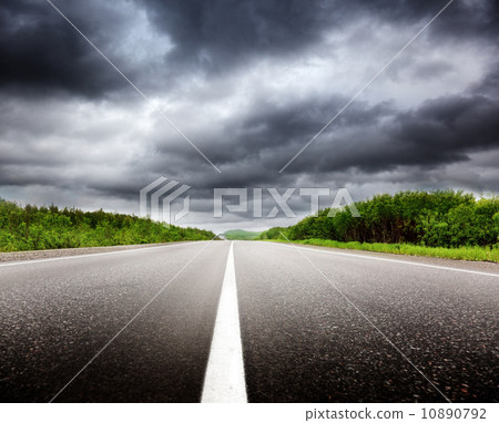 black clouds and road 10890792
