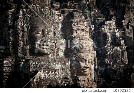 Huge carved Buddha faces of Bayon. Angkor Wat complex, Siem Reap, Cambodia 10892525