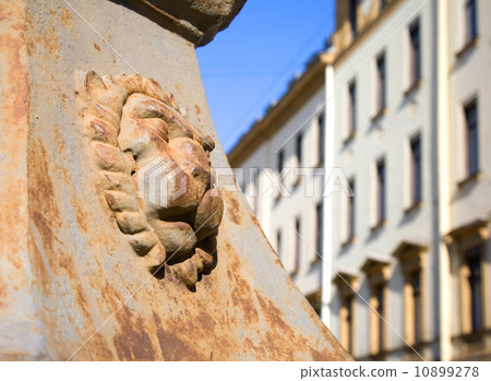 Lion relief on the base of street lamp in St.Petersburg Lion relief on the base of street lamp in St.Petersburg 10899278