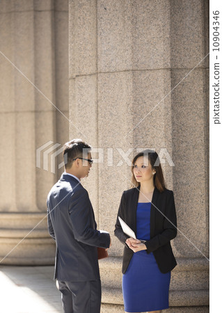 Asian business colleagues outside a Colonial building. Asian business colleagues outside a Colonial building. 10904346