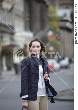 Portrait of a stylish caucasian woman in the city. 10904541