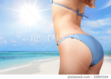 young woman in sexy bikini at the beach 10905564