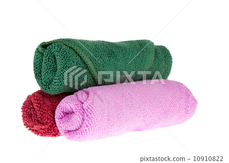 colorful towels rolls on white background 10910822