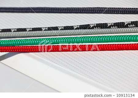 Color ropes on white boat deck background 10913134