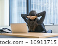 Asian executive in a jacket, working in the office on a laptop, she is looking out the window. Asian executive in a jacket, working in the office on a laptop, she is looking out the window. 10913715