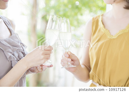Two women with champagne glasses Two women with champagne glasses 10917126