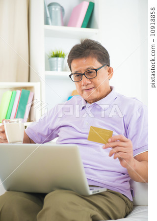 senior asian male online shopping from home senior asian male online shopping from home 10918858