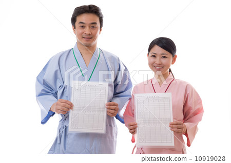 Men and women wearing surgical gowns 10919028