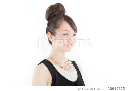 A pretty girl who set hair in a hairdresser in a fashionable dress 10919625