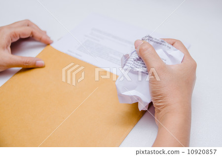 Crumpled paper in hand Crumpled paper in hand 10920857