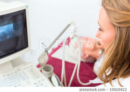 Doctor examining senior patient with ultrasonic Doctor examining senior patient with ultrasonic 10920922