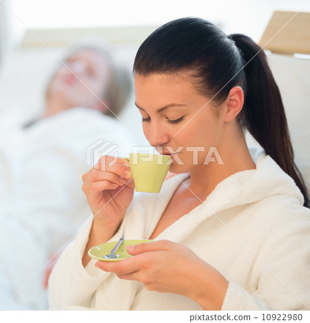 Woman drink coffee at spa 10922980