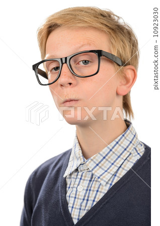 Serious teenage nerd boy wearing geek glasses Serious teenage nerd boy wearing geek glasses 10923030