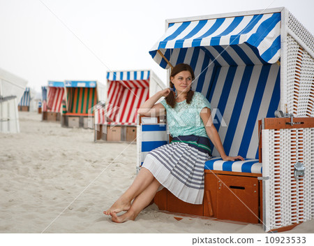 Young happy woman on the beach of St.Peter Ording, North Sea, Young happy woman on the beach of St.Peter Ording, North Sea, 10923533