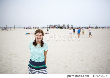 Young happy woman on the beach of St.Peter Ording, North Sea, 10923624