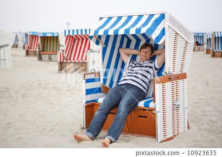 Young happy man on the beach of St.Peter Ording, North Sea, Young happy man on the beach of St.Peter Ording, North Sea, 10923635