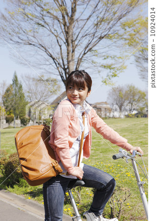 Bicycle and young lady 10924014